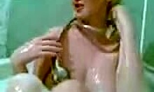 Buxom blonde diva bathes and sucks cock in bathroom