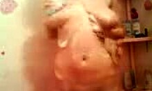 Amateur sweetie showers naked, her big tits and wet pussy on display in homemade porn.