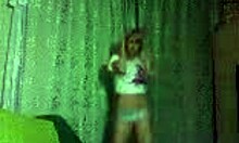 This petite blonde is dancing and teasing to the music