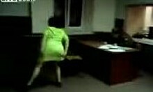 a mature brunette in a thong strips and dances while being filmed at home