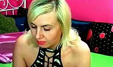 Horny blonde in lingerie fingers her pussy on webcam