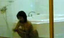 Yo, cute young Asian filmed taking a steamy shower in private bathroom