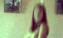 Petite young slut strips and dances on her bed