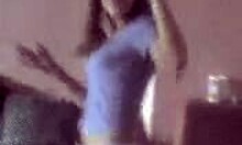 Petite young slut strips and dances on her bed