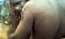 Russian blonde amateur strips naked outdoors, dancing with big natural tits and tan lines visible.