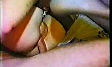 redheaded beauty kneels to suck two cocks. her stockings add to the wild fucking scene.