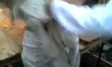 Russian blonde amateur strips naked outdoors, dancing with big natural tits and tan lines visible.