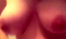 Aroused amateur babe adores playing with her big natural tits