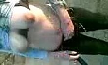 Hottie subtly flashes her big tits and sucks outdoors in this amateur clip.