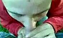 Slutty teen girlfriend sucks cock in condom outdoors 😈