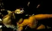 Irresistible stripper dances seductively, showing her ass in a thong at the night club