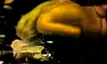 Irresistible stripper dances seductively, showing her ass in a thong at the night club