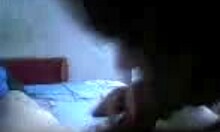 teenage brunette sucks boyfriend's cock in bedroom