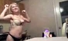 Blond MILF feels excited stripping naked in the kitchen for the camera