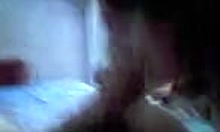 teenage brunette sucks boyfriend's cock in bedroom