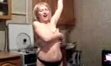 Blond MILF feels excited stripping naked in the kitchen for the camera