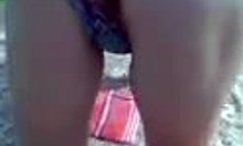 Bikini babe fingers her wet pussy on the beach! 😈