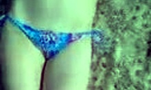 Bikini babe fingers her wet pussy on the beach! 😈