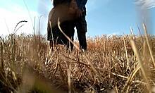 Sexy Milf in Dress Gives Handjob in Public Field, Showing Big Ass