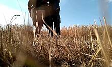 Sexy Milf in Dress Gives Handjob in Public Field, Showing Big Ass