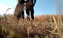 Sexy Milf in Dress Gives Handjob in Public Field, Showing Big Ass