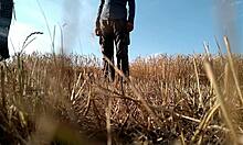 Sexy Milf in Dress Gives Handjob in Public Field, Showing Big Ass