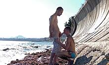 Intense gay sex on the beach
