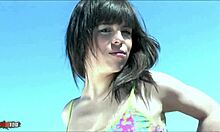 I-Ina Cherry, that Spanish babe, does a hot striptease on the beach, ripping clothes off!