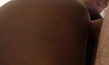 Interracial amateur couple engages in doggystyle fucking, leading to creampie in her shaved ebony pussy.