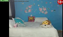 Teenager performs in front of webcam for the second time. She shows her enthusiasm.