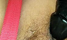 Wife playfully riding and playing with a large toy at home