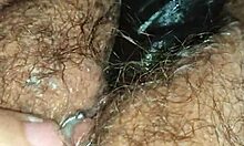 Wife playfully riding and playing with a large toy at home