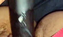 Wife playfully riding and playing with a large toy at home