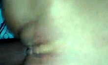 A couple enjoys a moment together in their bedroom.