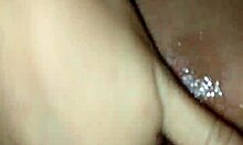 A couple enjoys a moment together in their bedroom.