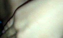 A couple enjoys a moment together in their bedroom.