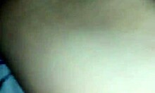 A couple enjoys a moment together in their bedroom.