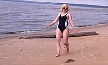 beautiful woman with big ass in costume charging at sea.