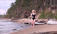 beautiful woman with big ass in costume charging at sea.