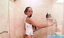 Teen Paris Milan spreads chocolate over body in shower.
