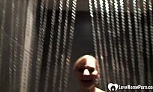 This cute babe teases in the shower with big boobs shaved and naked.