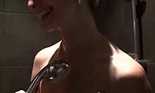 This cute babe teases in the shower with big boobs shaved and naked.