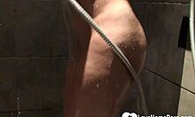 This cute babe teases in the shower with big boobs shaved and naked.