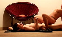 living room action unfolds with a curvy brunette caught on camera