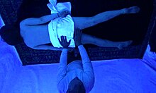 gigi breeze giving a slick blacklight massage