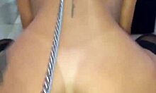 dog on leash serves master with ass