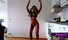 Joon Mali poses in kitchen with big ass