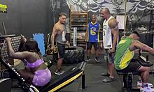 Black babe resists gym guys, gives ass and pussy.