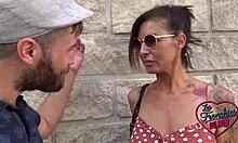 Charlotte, the flirty 40-year-old French barmaid, shows off her charm