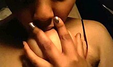 Black tits in red tank top get nipples sucked. 😉